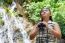 Girl Using Binoculars In Forest