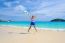 Girl Jumping With Happy On The Beach At Thailand