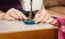 Woman's Hands Sewing On The Sewing Machine