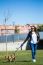 Beautiful Young Woman With Her Dog Walking In The Park