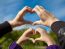 Girl And Her Mother Show Sign Of Heart With Their Hands