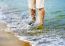 Female Legs With Sea Wave