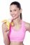 Energetic Woman Eating Banana