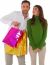 Happy Woman Looking At Man Carrying Shopping Bags