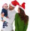 Happy Parents With Son Wearing Santa Hats