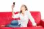 Woman Puckering While Taking Selfie On Sofa