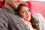 Loving Young Woman With Boyfriend Relaxing On Sofa