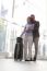 Loving Young Man Embracing Woman At Airport