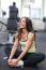 Happy Woman Having A Break From Exercising In Health Club