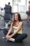 Happy Woman Having A Break From Exercising In Health Club