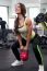 Fit Woman Working Out With A Kettle Bell