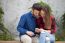 Young Couple Using Smart Phone