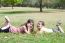 Children Lie Down On Grass