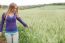 Woman Standing Beside The Field