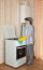 Young Woman Washes A Gas Stove