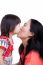 Mother And Daughter Kissing On White Background. Mothers Day