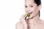 Happy Beauty Woman Eating Spinach