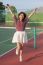 Asian Woman In Sport Tennis Course Jumping With Happiness Emotion