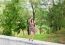 Young Beautiful Smiling Girl Posing While Standing In The Park