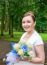 Young Smiling Bride With A Bouquet Of Roses