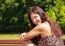 Portrait Of A Young Beautiful Brunette In A City Park