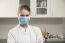 Women Doctor With Face Mask In The Office