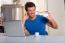 Man In Kitchen With Laptop