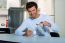 Man Having Tea In Kitchen