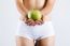 Beautiful Young Woman In White Underwear Holding Green Apple