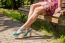 Girl Sitting On A Park Bench