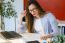 Beautiful Young Woman Working With Laptop In Her Office