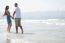 Couple Walking At Beach