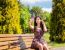 Young Girl Making Selfie Sitting On A Park Bench