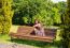 Young Girl Sitting On A Park Bench