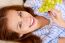 Young Woman Holding Grapes