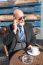 Bearded Businessman With Sunglasses Talking On Smartphone