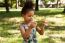 Young Child Using Smartphone At Park