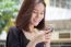 Portrait Of Thai Adult Student University Beautiful Girl Using Her Smart Phone