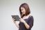 Portrait Of Thai Adult Student University Beautiful Girl Using Her Tablet