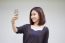 Portrait Of Thai Adult Student University Beautiful Girl Using Her Smart Phone Selfie