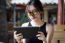 Portrait Of Thai Adult Student University Beautiful Girl Using Her Tablet