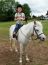 Girl Riding A Grey Pony