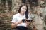 Portrait Of Thai Adult Student University Beautiful Girl Using Her Tablet