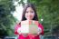 Portrait Of Thai Teen Beautiful Girl In Chinese Dress, Happy New Year And Open Box Gift, Smile And Very Happy