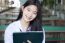 Portrait Of Thai Student Teen Beautiful Girl Using Her Tablet