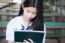 Portrait Of Thai Student Teen Beautiful Girl Using Her Tablet