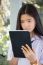 Portrait Of Thai Student Teen Beautiful Girl Using Her Tablet