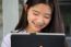 Portrait Of Thai Student Teen Beautiful Girl Using Her Tablet