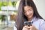 Portrait Of Thai Student Teen Beautiful Girl Using Her Phone And Smile