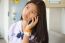 Portrait Of Thai Student Teen Beautiful Girl Using Her Phone And Smile